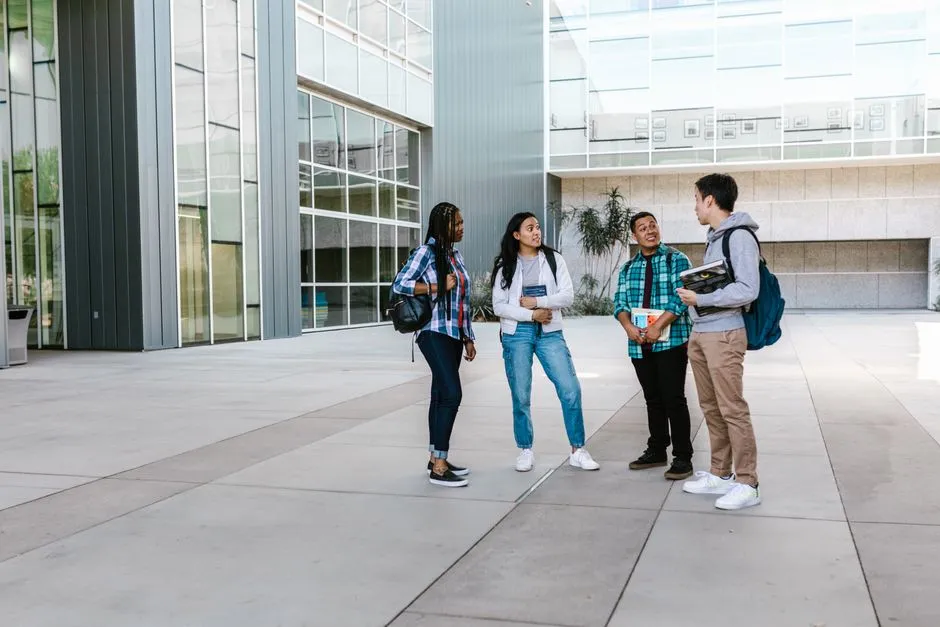 Community college students walking together across a campus courtyard
